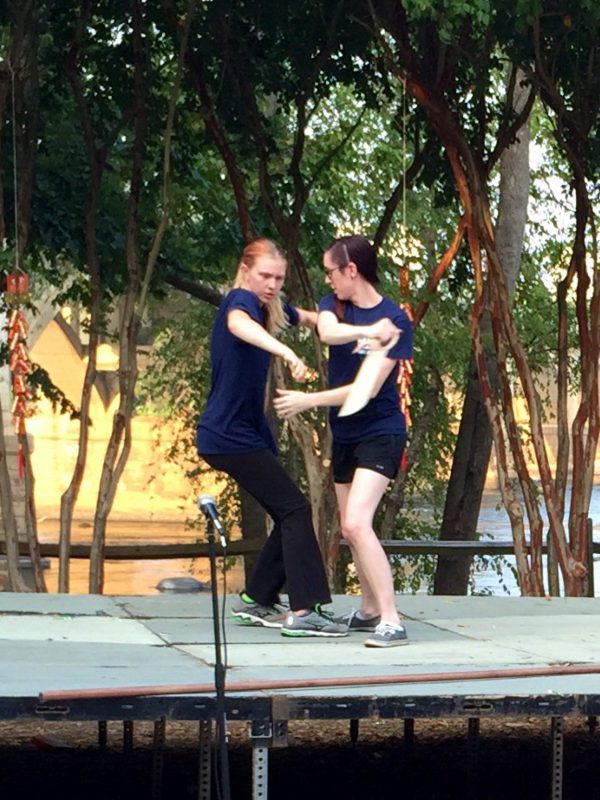 Doing the butterfly sword vs dragon staff demo at the Moon Festival with my friend (staff was knocked down at this point)